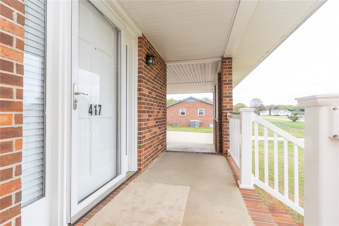 417 Greenmeadow Circle Anderson, SC 29626 - Photo 6 of 41 Welcome home to this charming brick residence featuring a lovely covered porch with direct access to the carport.