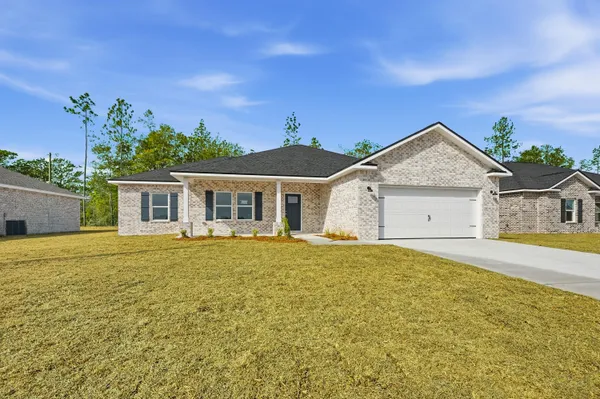 front view of a house with a yard