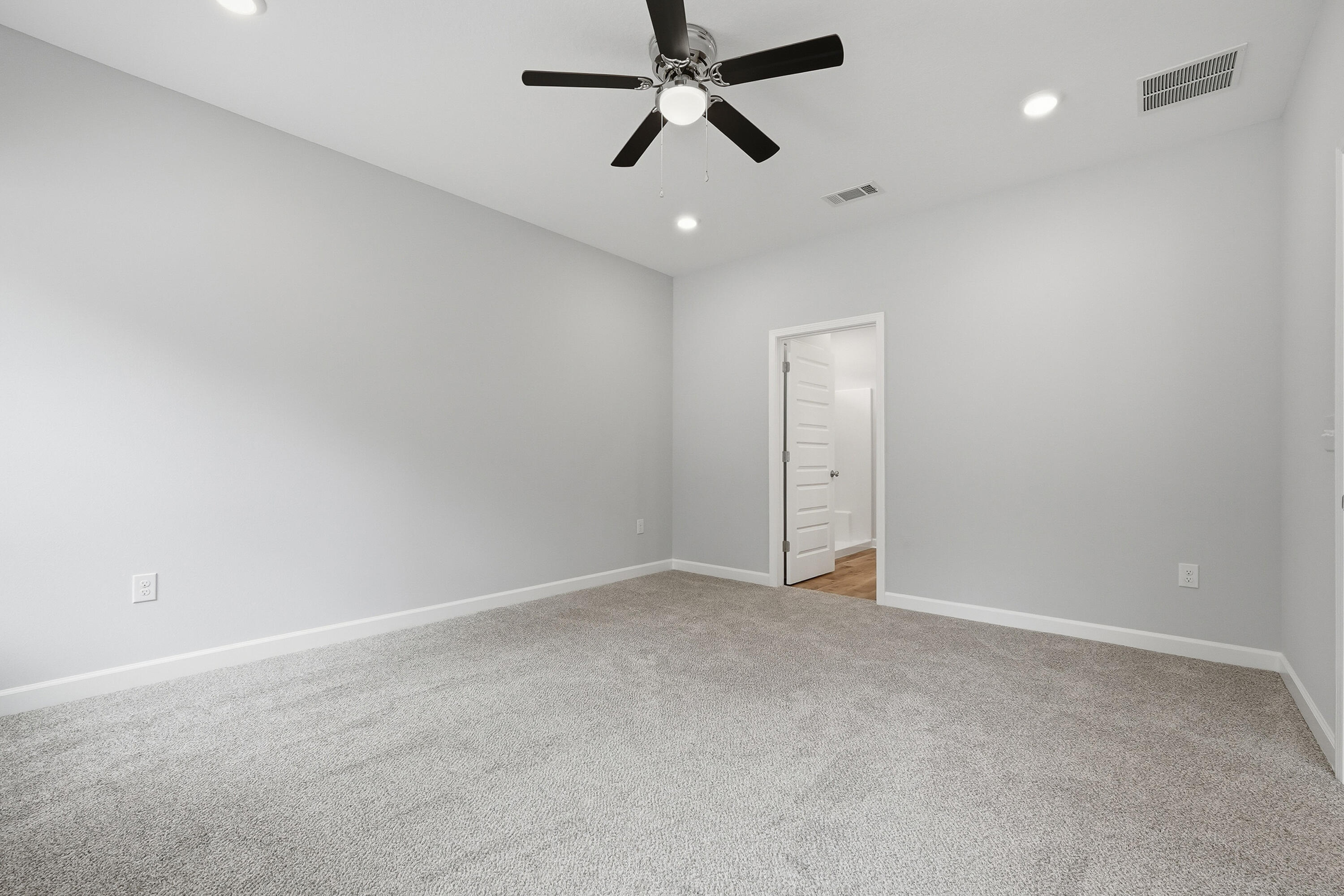 6104 Mildred's Way Crestview, FL 32539 - Photo 11 of 23 an empty room with closet and a ceiling fan