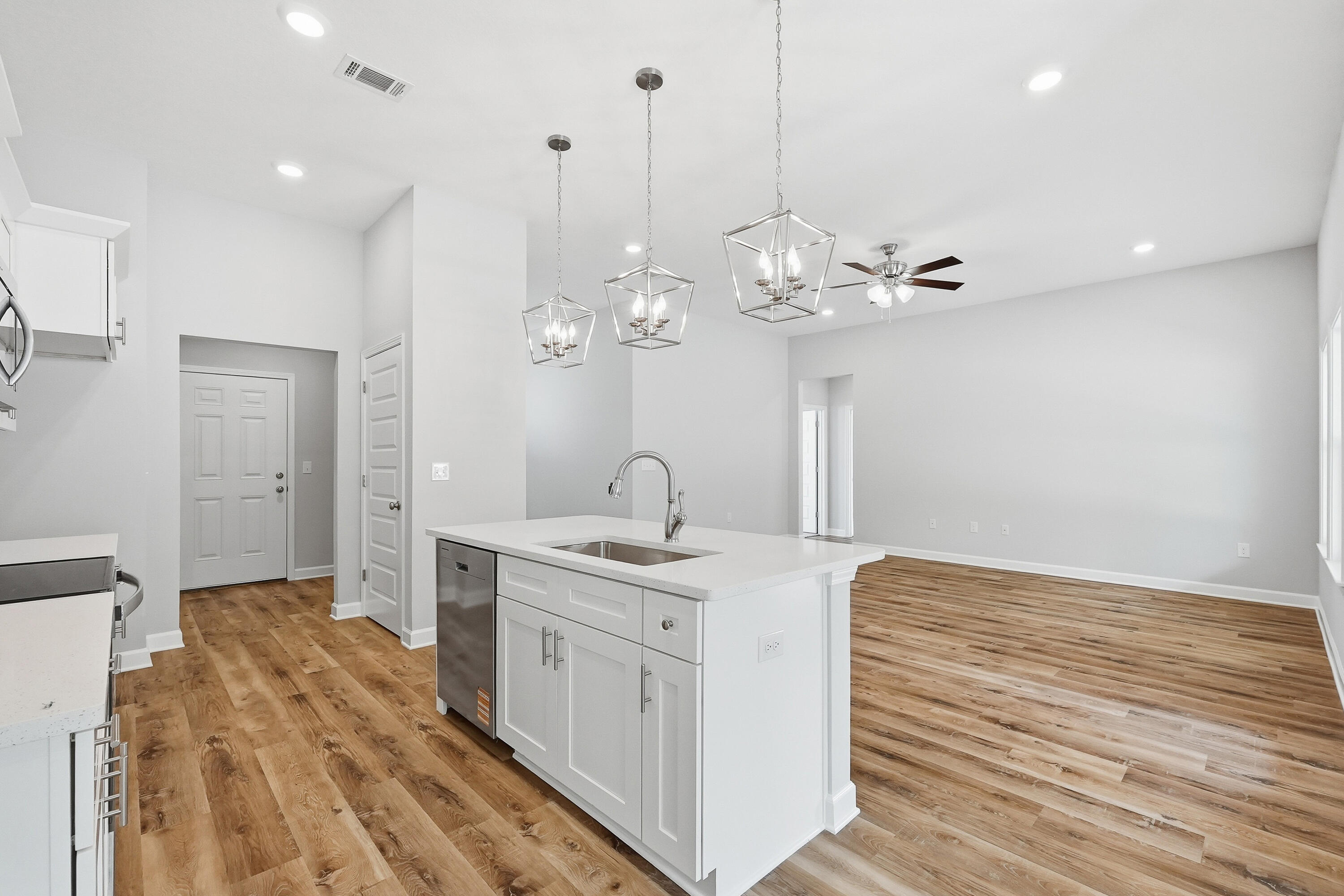 6104 Mildred's Way Crestview, FL 32539 - Photo 10 of 23 a spacious bathroom with a granite countertop sink a mirror and a shower
