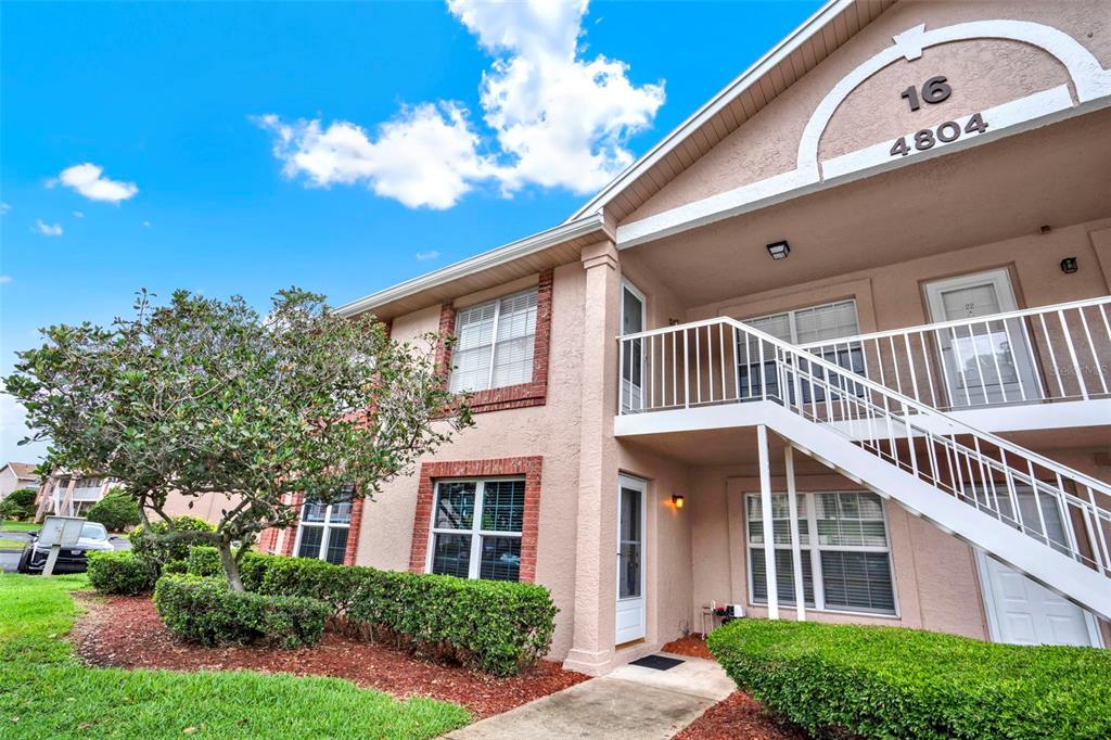 4804 Myrtle Oak Drive, Unit 11 New Port Richey, FL 34653 - Photo 1 of 1 a front view of a house with a yard