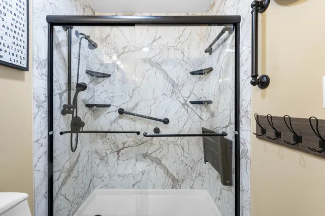 a bathroom with a bathtub and shower