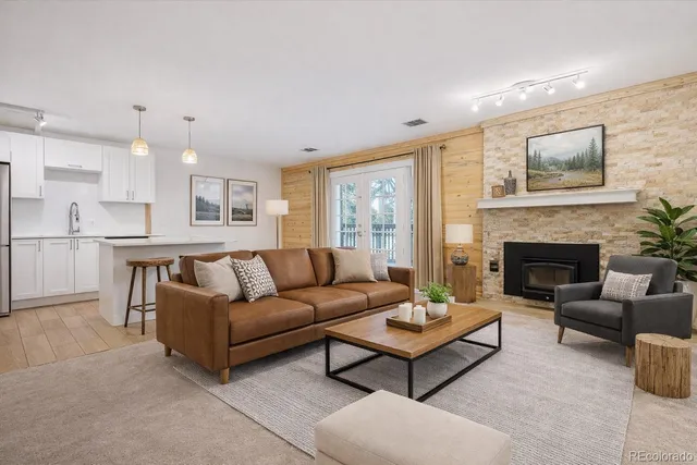 a kitchen with stainless steel appliances a refrigerator sink and microwave