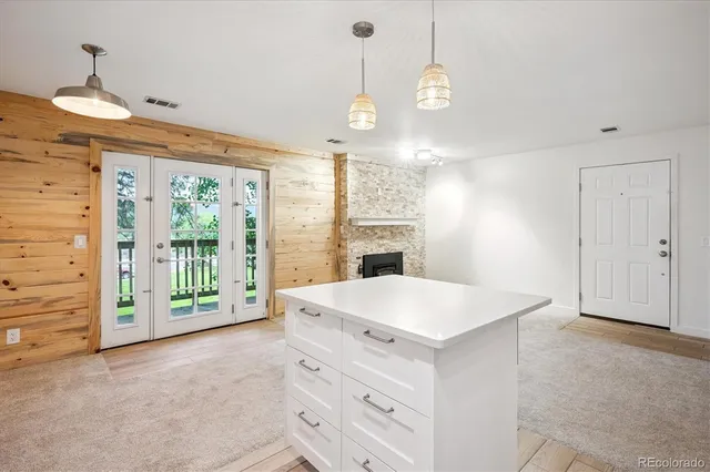 a kitchen with stainless steel appliances a refrigerator and a stove