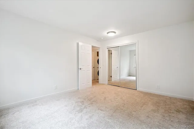 a view of an empty room with a fireplace
