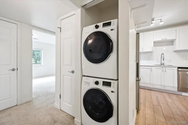 a view of a hallway with washer and dryer