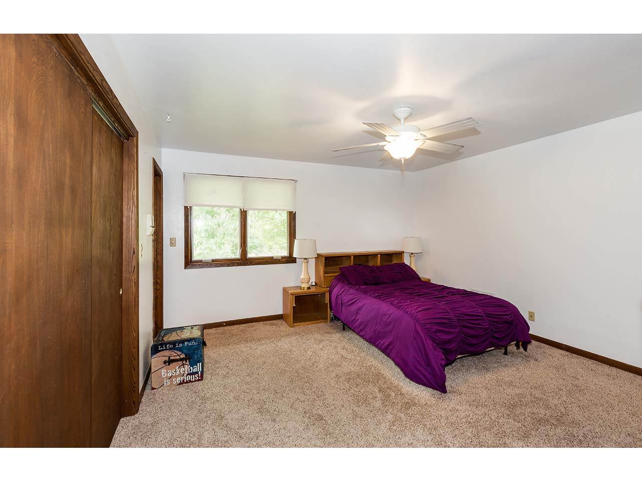 2952 Yale Bridge Road South Beloit, IL 61080 - Photo 13 of 22 a living room with a bed and a ceiling fan
