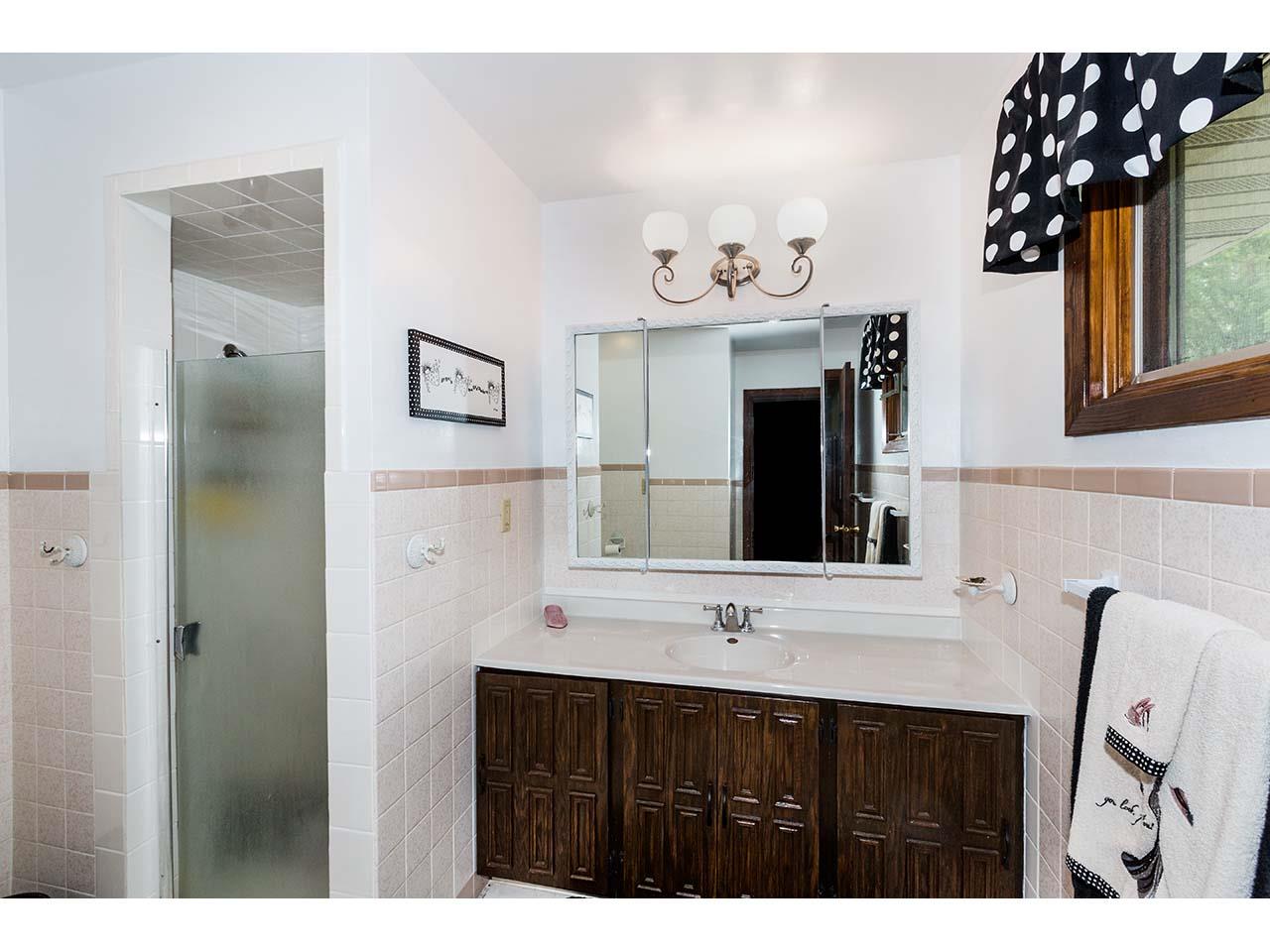 2952 Yale Bridge Road South Beloit, IL 61080 - Photo 14 of 22 a bathroom with a sink vanity and a mirror