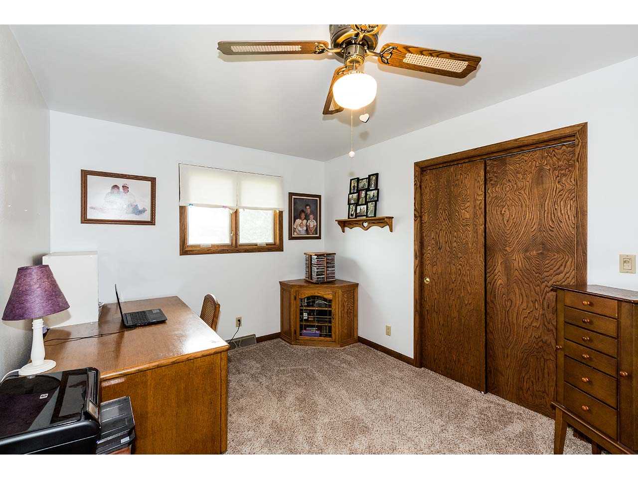 2952 Yale Bridge Road South Beloit, IL 61080 - Photo 19 of 22 a bedroom with a bed and wooden floor