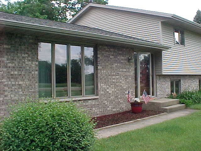 2952 Yale Bridge Road South Beloit, IL 61080 - Photo 2 of 22 a front view of a house with garden