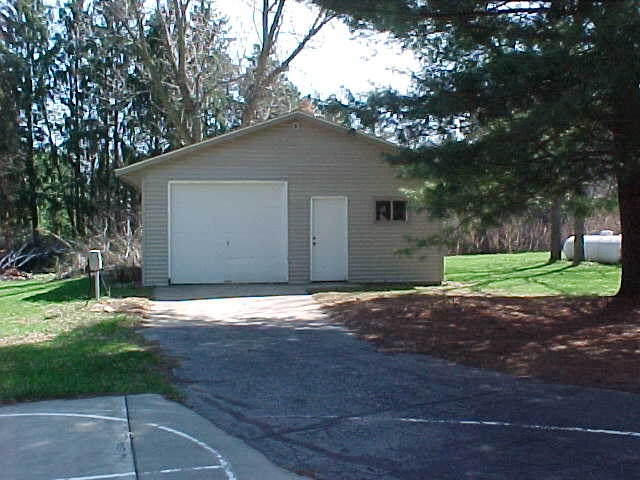 2952 Yale Bridge Road South Beloit, IL 61080 - Photo 21 of 22 a house that has a tree in front of it