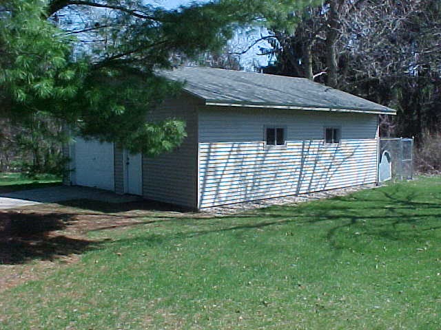 2952 Yale Bridge Road South Beloit, IL 61080 - Photo 22 of 22 a view of a house with a yard