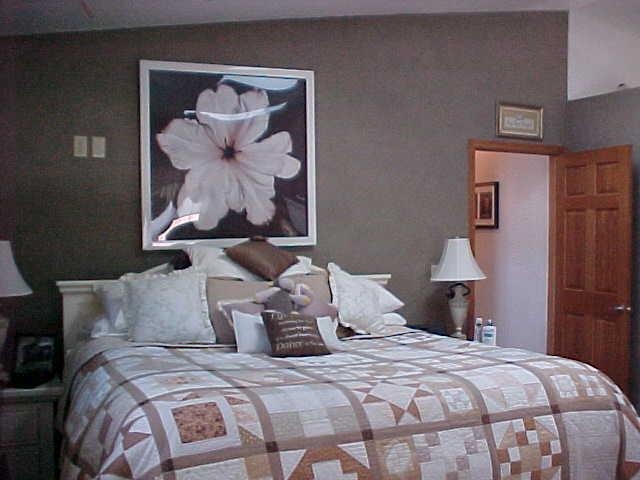 2952 Yale Bridge Road South Beloit, IL 61080 - Photo 8 of 22 a bedroom with bed and painting on the wall