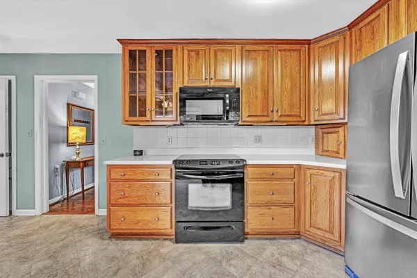a kitchen with granite countertop stainless steel appliances and cabinets