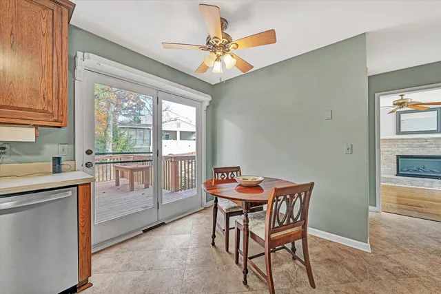 a kitchen that has a table and chair in it