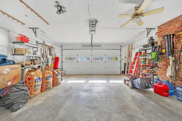 a view of a garage with a bike and car