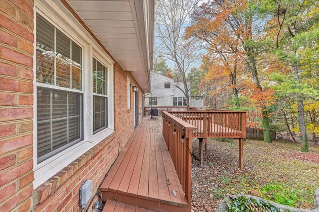 a view of deck with wooden floor and seating space