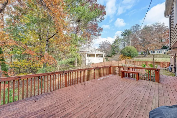 a view of a house with a yard and sitting area