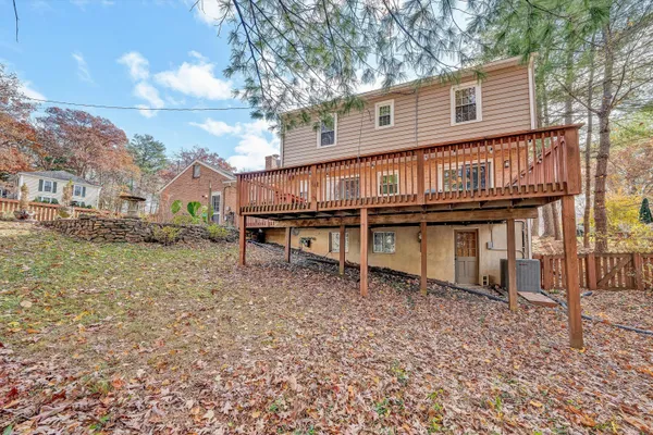 a view of a dry yard with wooden fence