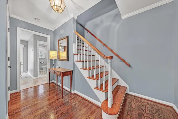 a view of an entryway with wooden floor