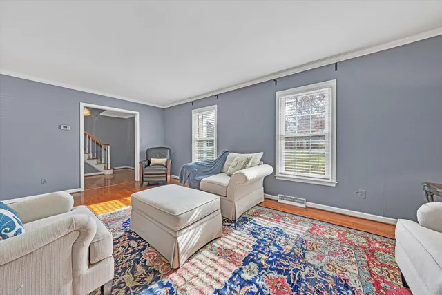 a living room with furniture and a rug