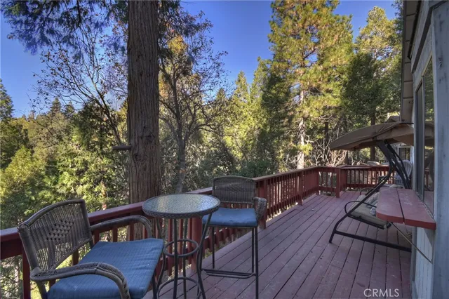 a view of a chairs and table on the wooden floor