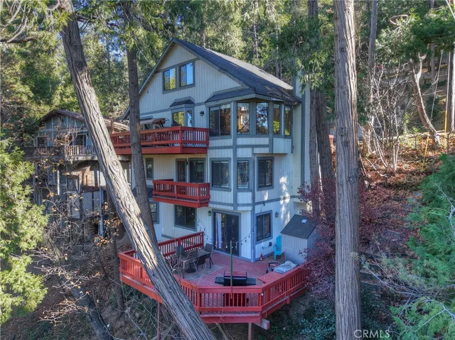 a room with pool table and wooden floor