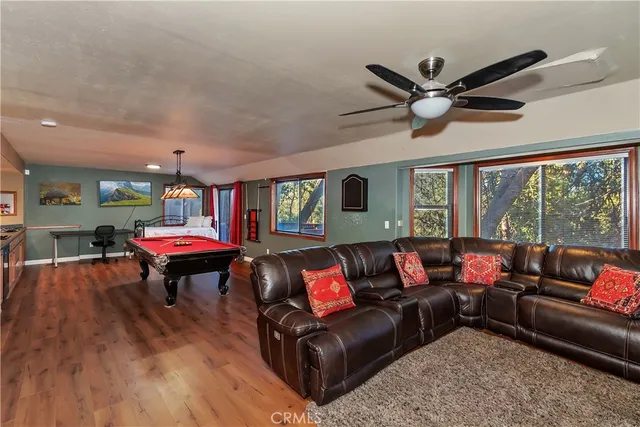 a kitchen with stainless steel appliances a stove a sink and a refrigerator