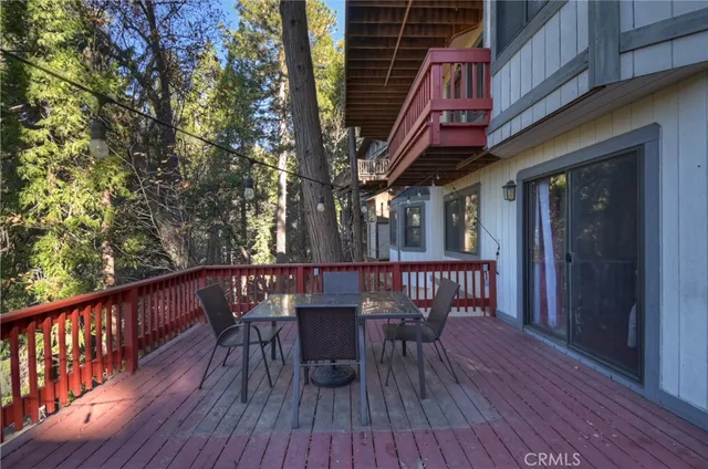 a view of a table and chairs on the roof deck