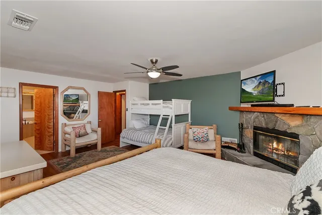 a view of a bedroom with furniture and window