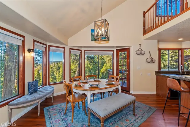 a living room with furniture a window and a dining table