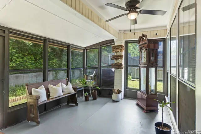 a kitchen with cabinets appliances and a dining table