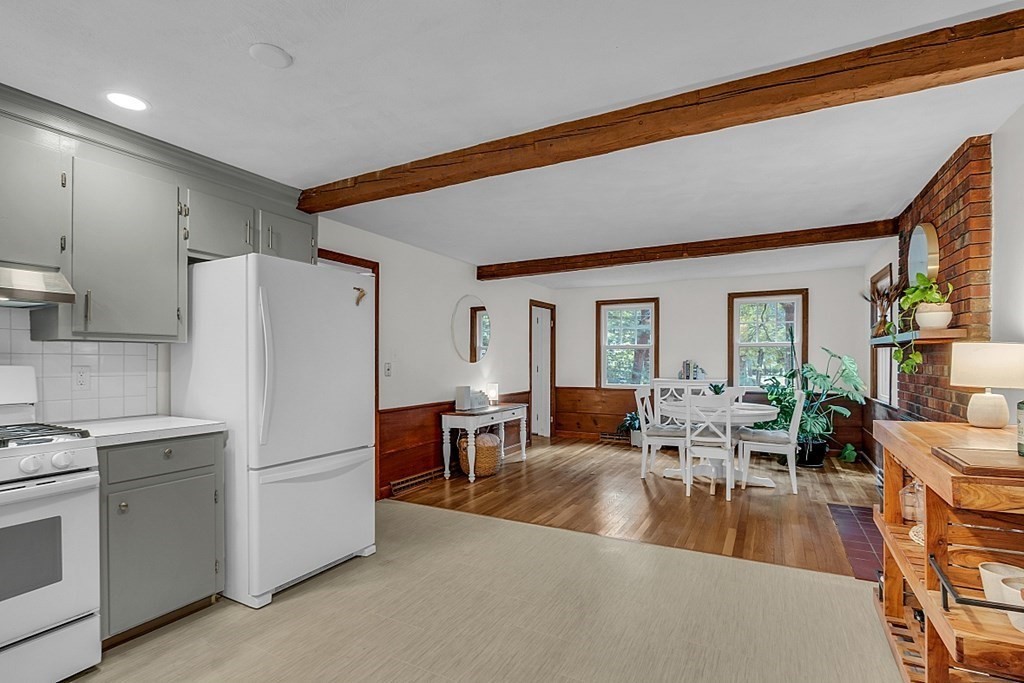 24 Whippletree Road Chelmsford, MA 01824 - Photo 12 of 34 a living room with furniture a dining table and chairs