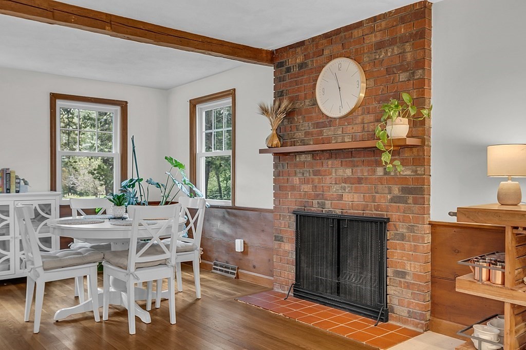 24 Whippletree Road Chelmsford, MA 01824 - Photo 14 of 34 a living room with furniture a fireplace and a floor to ceiling window