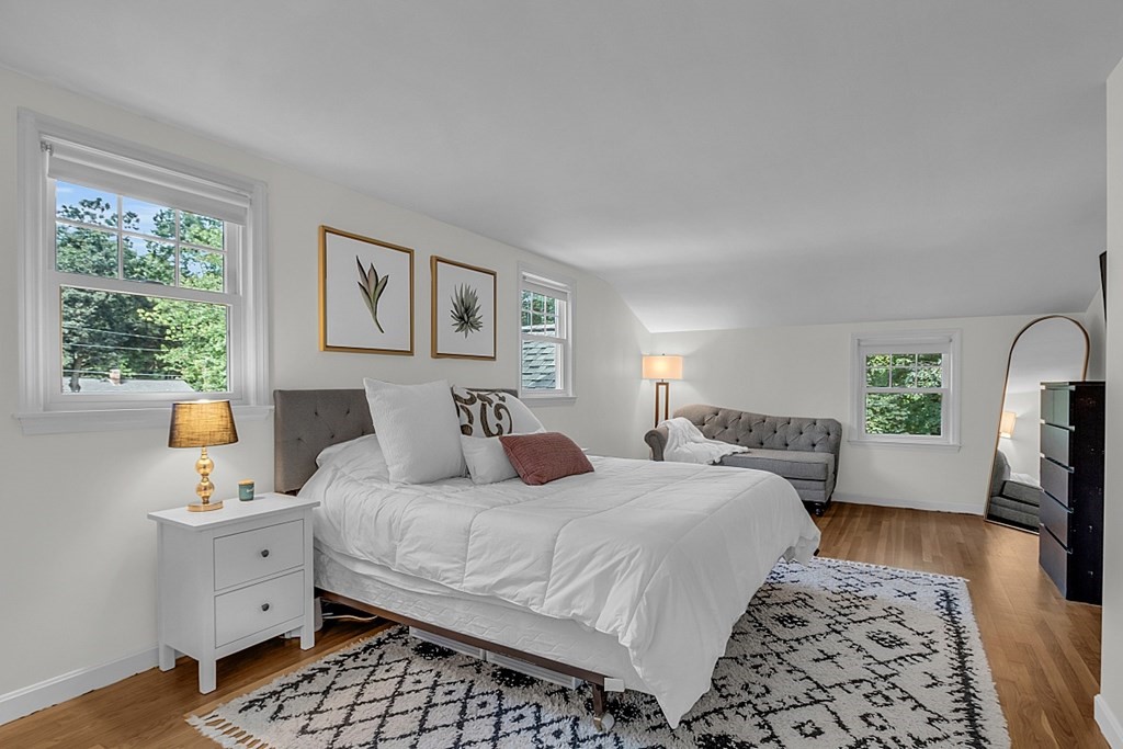 24 Whippletree Road Chelmsford, MA 01824 - Photo 24 of 34 a bedroom with a bed and wooden floor