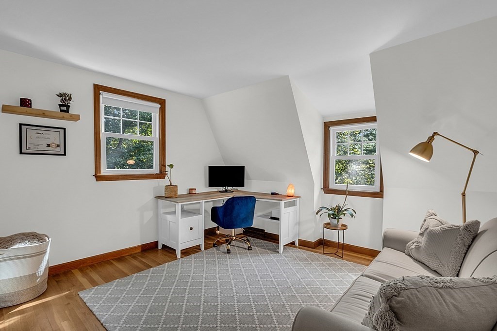 24 Whippletree Road Chelmsford, MA 01824 - Photo 28 of 34 a livingroom with workspace and a couch