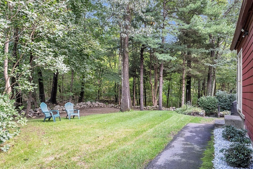24 Whippletree Road Chelmsford, MA 01824 - Photo 6 of 34 a view of a chairs in a backyard