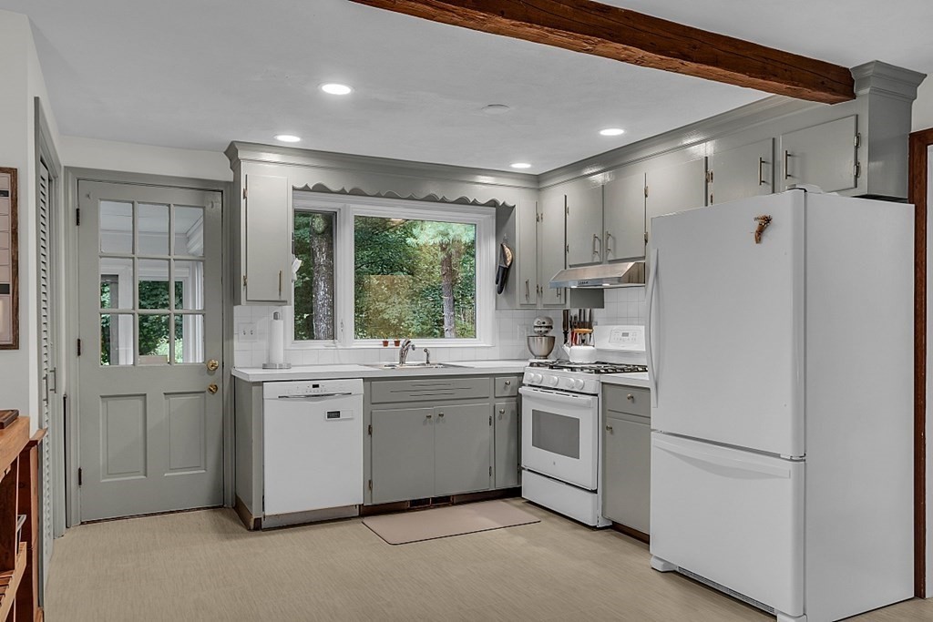 24 Whippletree Road Chelmsford, MA 01824 - Photo 10 of 34 a kitchen with white cabinets and white appliances