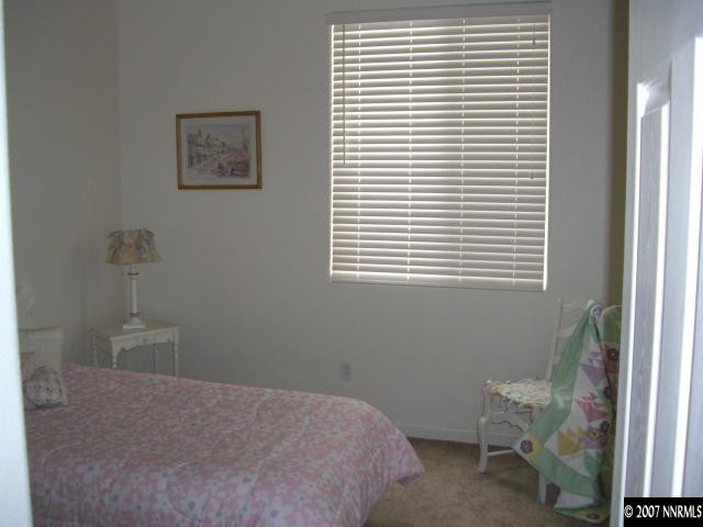 2305 Clementine Lane Reno, NV 89521 - Photo 5 of 9 a bedroom with a bed and a window