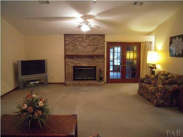 7732 Elrod Road Milton, FL 32583 - Photo 3 of 17 Living Room with Enclosed Brick Fireplace