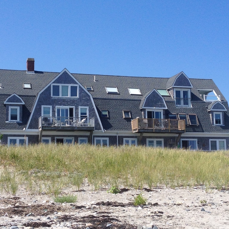 175 Beach Avenue, Unit 1 Hull, MA 02045 - Photo 1 of 1 a front view of a house with a boat