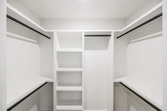 a view of an empty walk in closet