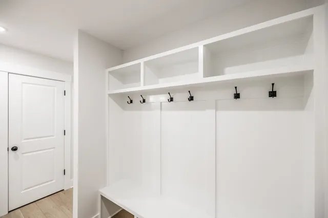a white cabinet with white walls