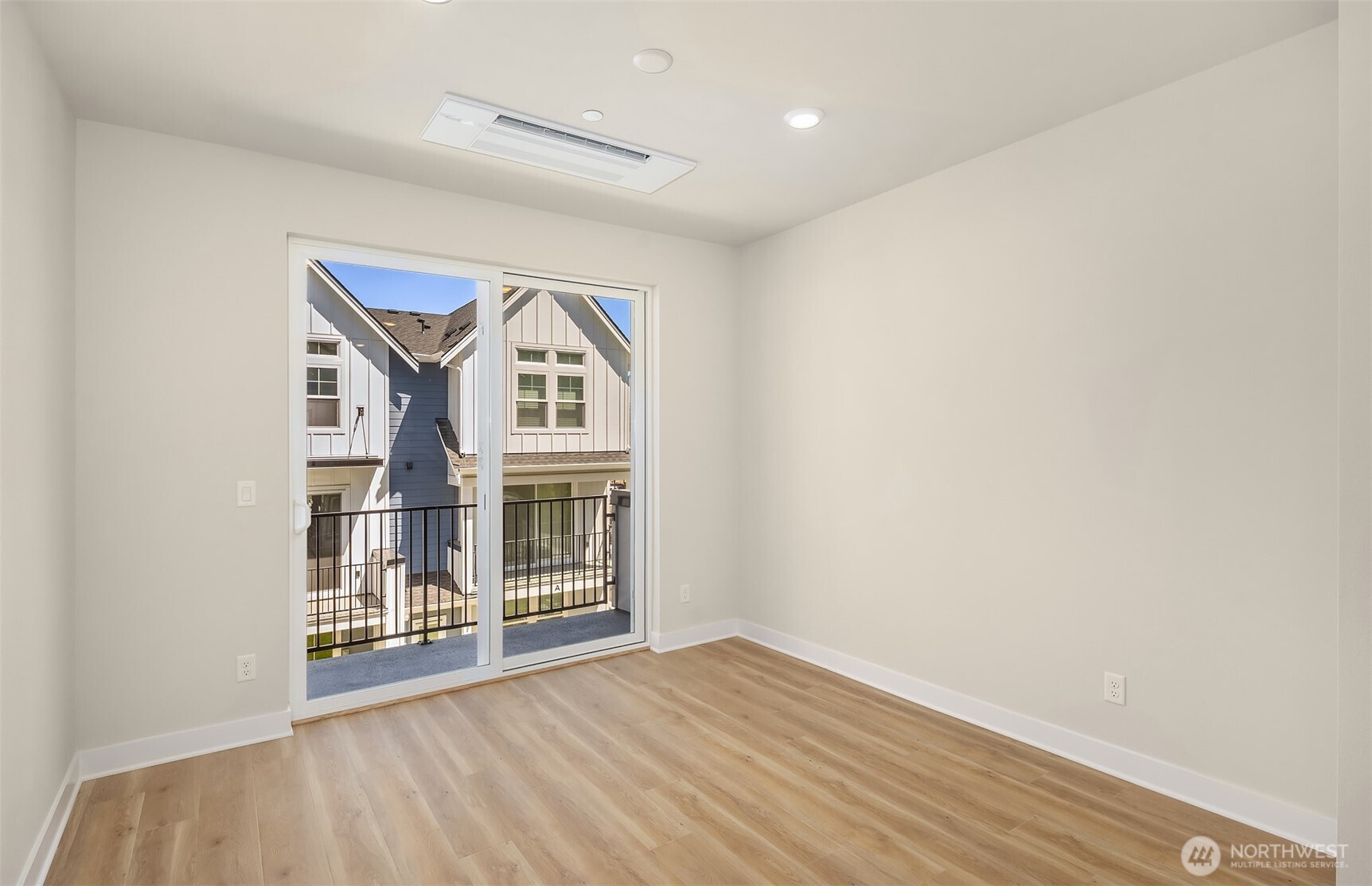 20347 90th Drive Northeast, Unit B Bothell, WA 98011 - Photo 7 of 8 a view of a big room with wooden floor and windows