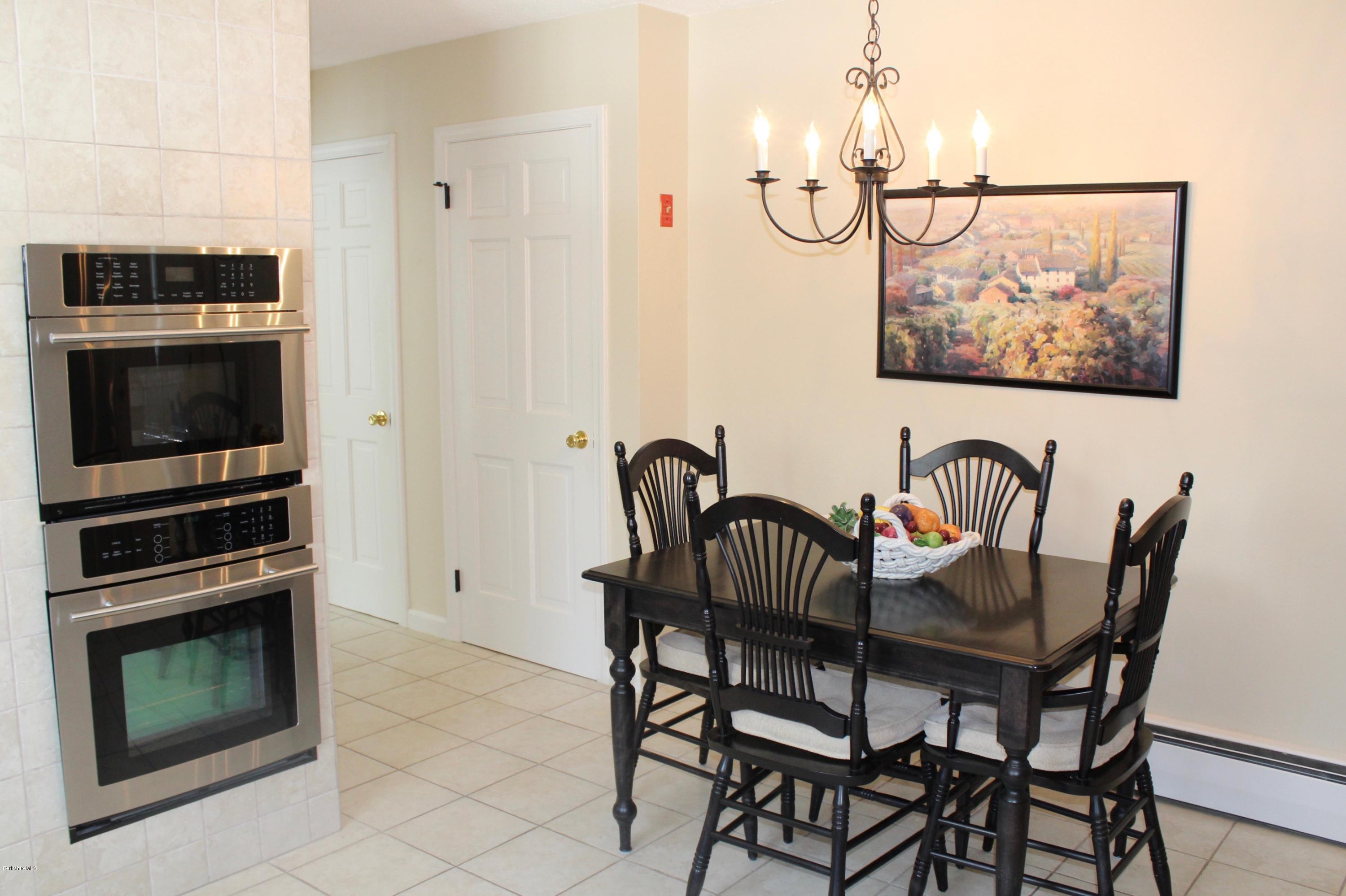 125 Dublin Road Richmond, MA 01201 - Photo 11 of 38 a view of a dining room with furniture and wooden floor