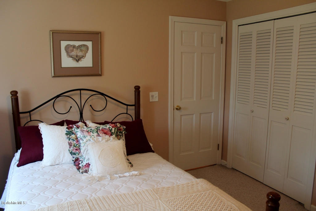 125 Dublin Road Richmond, MA 01201 - Photo 27 of 38 a bedroom with a bed and a table in it