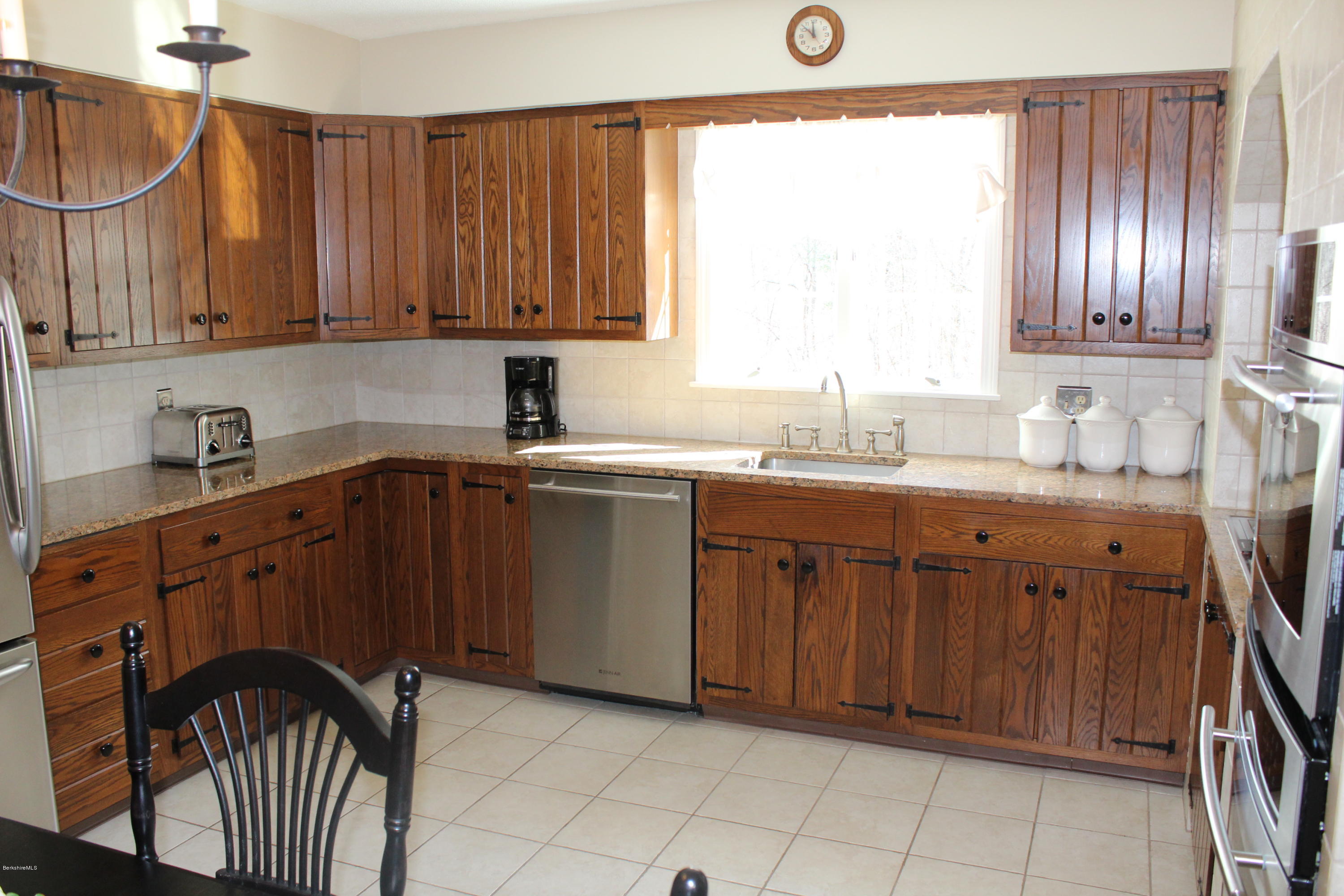 125 Dublin Road Richmond, MA 01201 - Photo 8 of 38 a kitchen with stainless steel appliances granite countertop a sink stove and cabinets