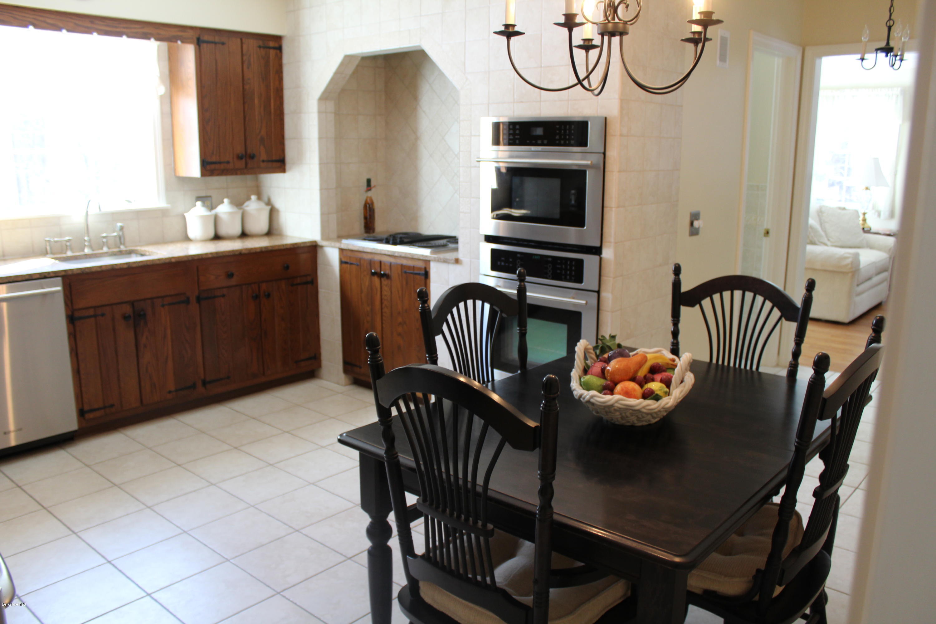 125 Dublin Road Richmond, MA 01201 - Photo 10 of 38 a view of a dining room with furniture and a chandelier