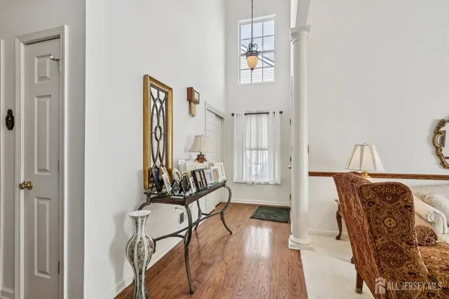 a view of a livingroom with furniture and hardwood floor