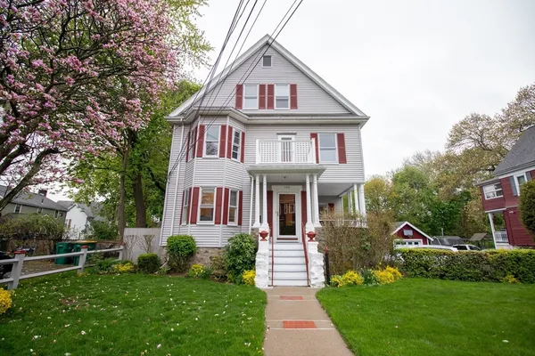 a front view of a house with a yard